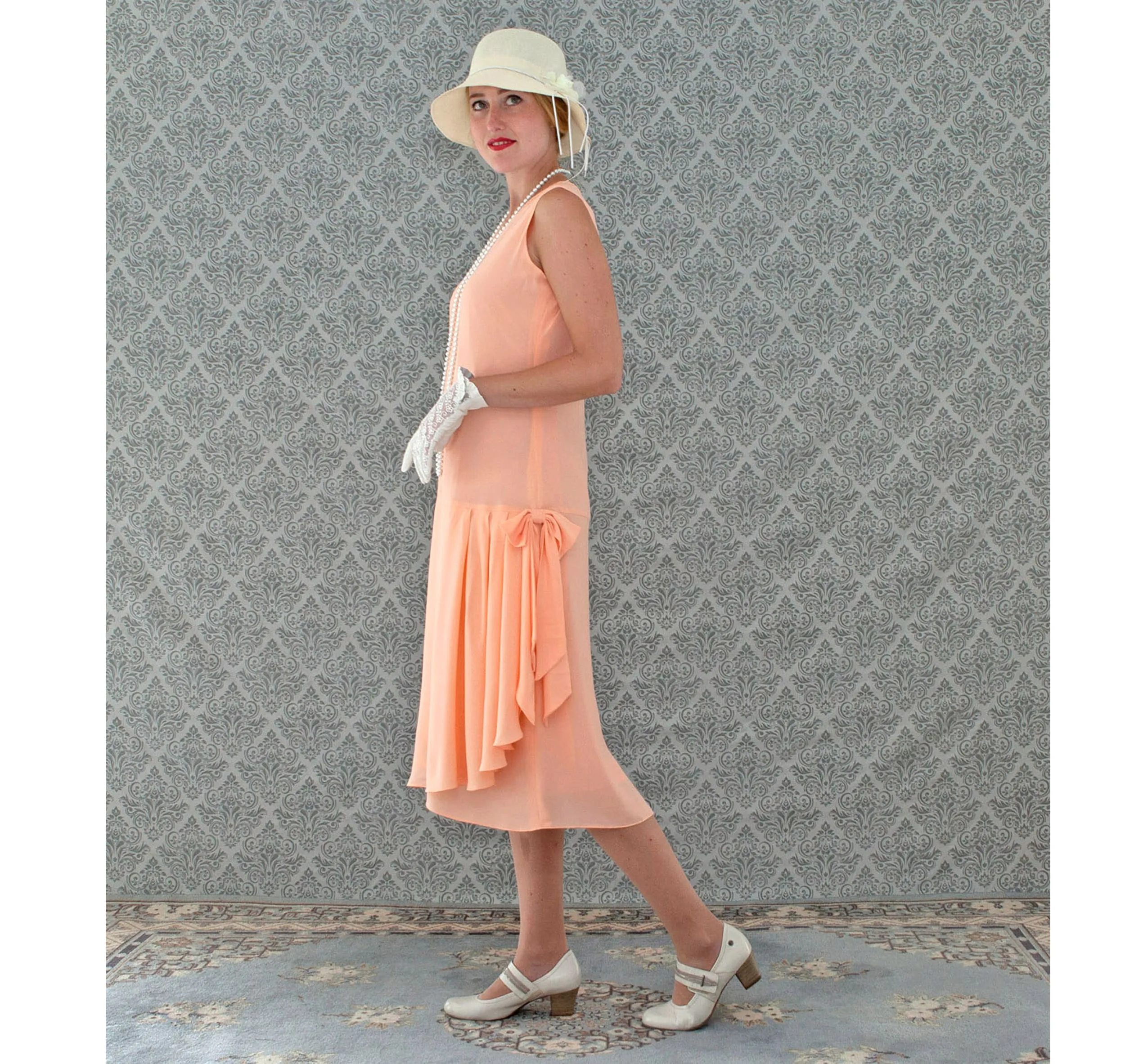 Peach Great Gatsby chiffon dress with drape and bow